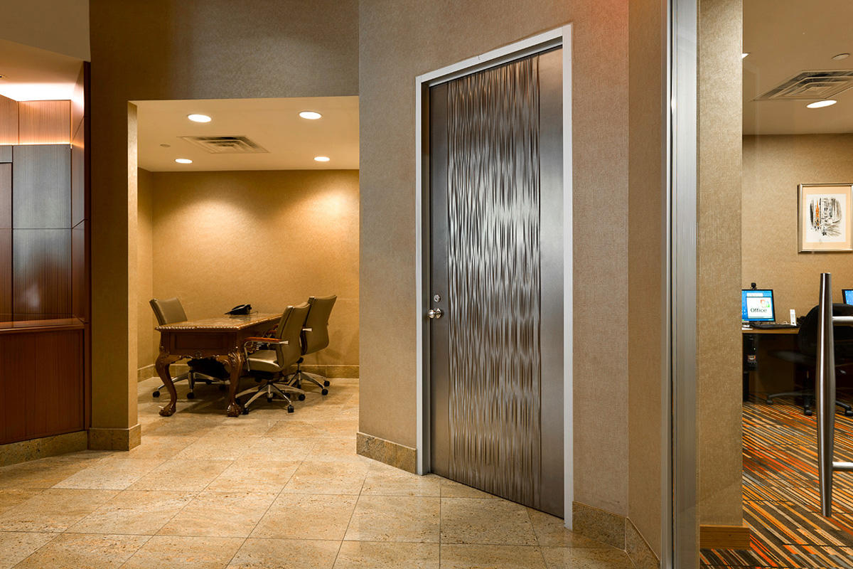 Door shown in Fused Nickel Silver with Seastone finish and Kalahari pattern at t