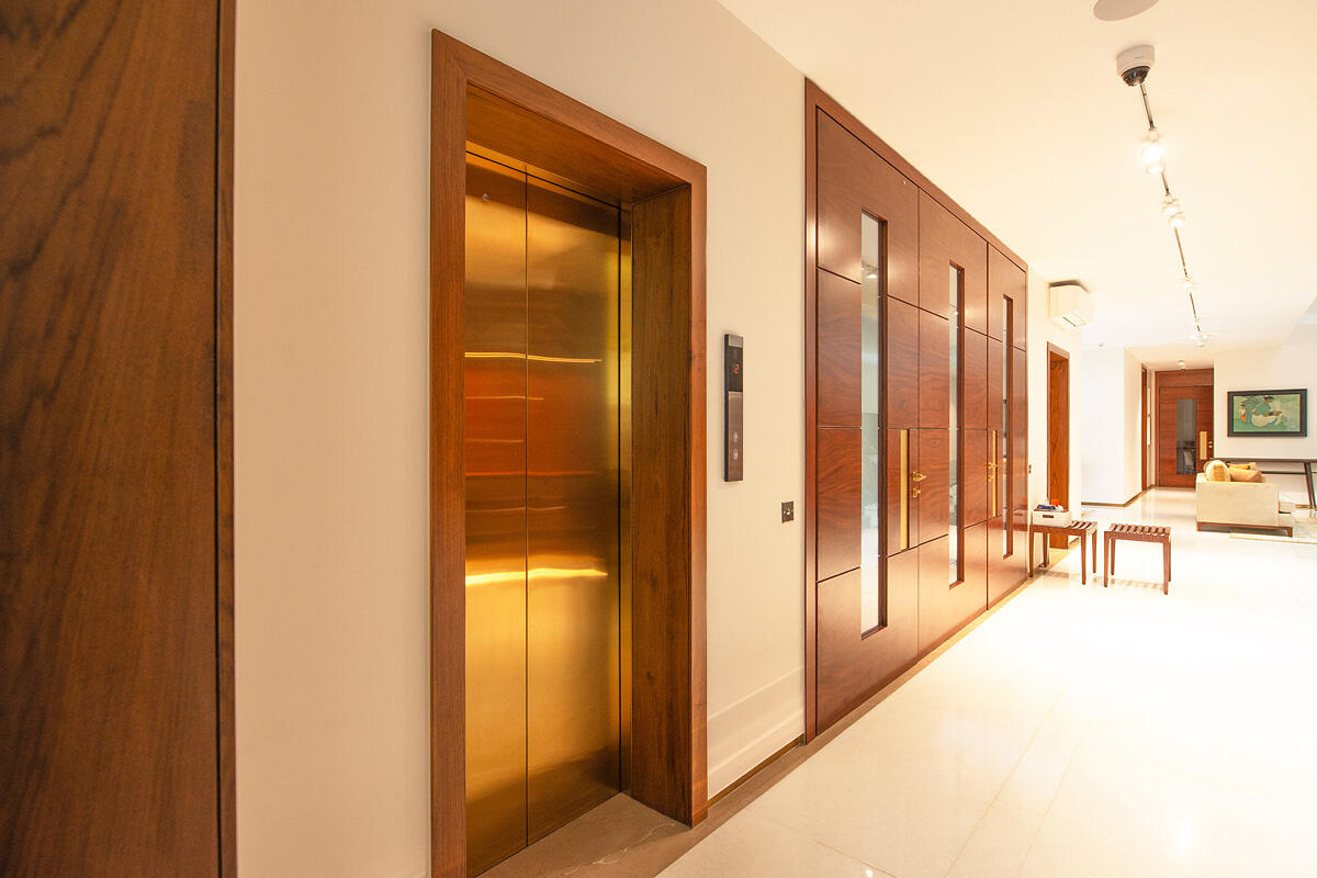 Elevator doors in custom Fused Metal color with Satin finish at Private