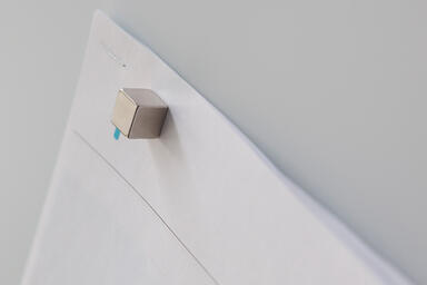 Cube magnet, 3/8" x 3/8" x 3/8", shown on ViviChrome Scribe glass, White interla