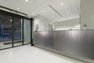 Reception desk shown with CastGlass Classic Levels glass in Hikaru + Taupe