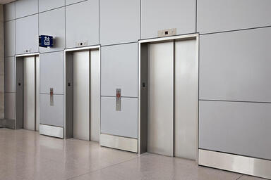 Stainless Steel Elevator Doors in Seastone finish with Dallas Impression