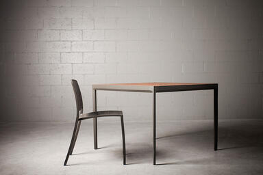 Avivo Chair shown with Slate Texture powdercoat and Riva perforation pattern