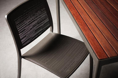 Avivo Chair shown with Slate Texture powdercoat and Riva perforation pattern