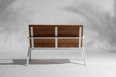 Vaya bench shown with White Texture powdercoated frame and FSC&reg; 100% Cumaru