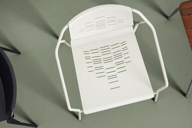 Factor Chair with arms shown with formed aluminum seat in Alabaster Texture