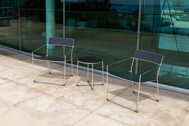 Linia Lounge Chairs shown with Ink Blue Texture powdercoated seats and backs