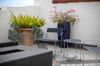 Linia Lounge Chairs shown with Ink Blue Texture powdercoated seats and backs