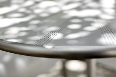 Detail of Citrus Table with 36&quot; table top in Stainless Steel with Satin finish