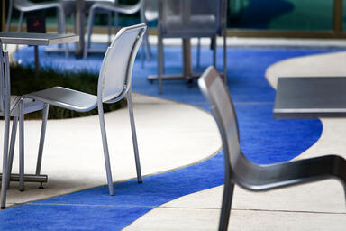 Vista Chairs shown with Bright Silver Gloss powdercoat; Cross Tables also shown
