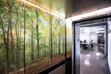 LEVELe-105 Elevator Interior with LightPlane Panels in ViviSpectra Zoom glass wi