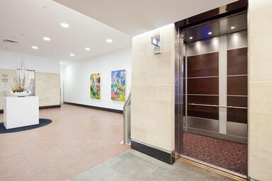 LEVELe-107A Elevator Interior; Capture panels in custom American Cherry 