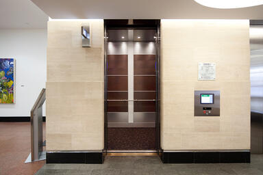 LEVELe-107 Elevator Interior with Capture panels in American Cherry with Dark Ma