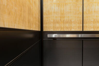 LEVELe-105 Elevator Interior with upper panels in ViviStone Honey Onyx