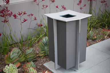 Knight Litter Receptacle shown with Slate Texture powdercoat at 2600 Michelson