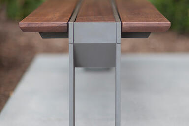 Apex Bench shown with Slate Texture powdercoated frame and FSC&reg; 100% Jatoba