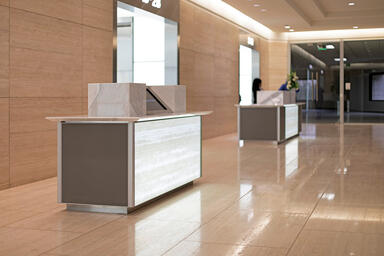Reception desks with LightPlane Panels in ViviGraphix Graphica glass with custom