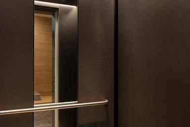 LEVELe-105 Elevator Interior with customized panel layout; panels in Bonded Nick