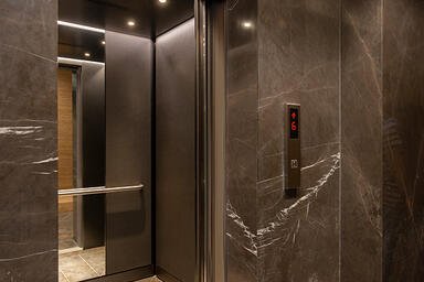 LEVELe-105 Elevator Interior with customized panel layout; panels in Bonded Nick