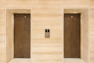 Bonded Metal Elevator doors shown in Bonded Bronze