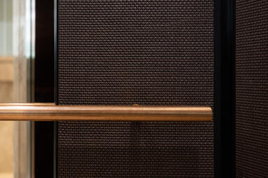 LEVELe-105 Elevator Interiors with customized panel layout; Bonded Bronze