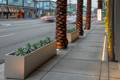 Custom planters in Stainless Steel with Seastone finish and Stainless Steel with