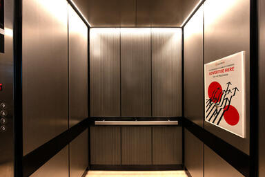 LEVELe-105 Elevator Interior, Capture panels in Bonded Aluminum with Dark Patina