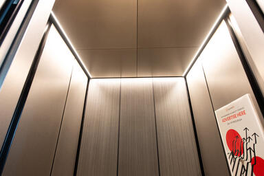 LEVELe-105 Elevator Interior, Capture panels in Bonded Aluminum with Dark Patina