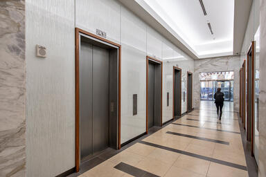 Elevator lobby walls with ViviGraphix Graphica glass in Reflect configuration wi