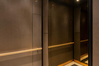 LEVELe-105 Elevator Interiors with customized panel layout; Minimal panels in Bo