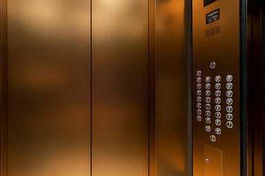 Elevator doors in Fused Bronze with Seastone finish; LEVELe-105 Elevator Interio