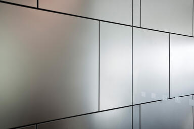 LEVELe Wall Cladding System with Float panels in Stainless Steel with Seastone
