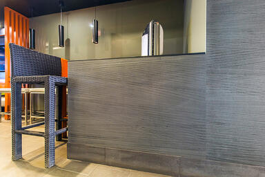 Wall panels shown in Bonded Aluminum with Custom Patina and Talus pattern 