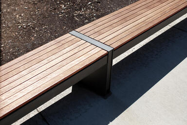 Detail of Vector Seating System showing two 8-foot add-on benches with Slate