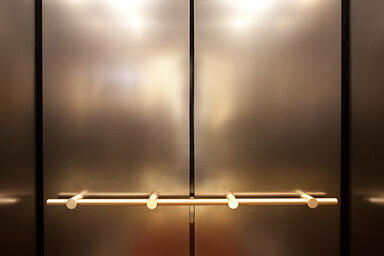 LEVELc-1000A Elevator Interior in Fused Nickel Silver with Linen finish