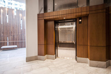 LEVELe-105 Elevator Interior; Capture panels in Fused Bronze with Mirror finish 