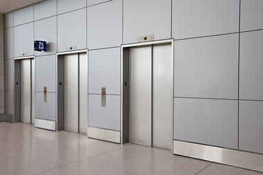 Elevator doors in Stainless Steel with Sandstone finish and Dallas pattern 