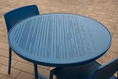 Avivo Chairs with custom Azure Texture powdercoat and Riva perforation pattern