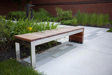 Duo Bench shown with Polished Stainless Steel frame and FSC 100% hardwood