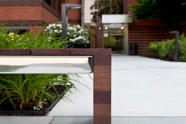Duo Bench shown with Polished Stainless Steel frame and FSC 100% hardwood