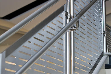 Railing infill shown in Stainless Steel with custom perforation 