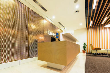 Wall panels in Fused Bronze with Linen finish and custom Circa perforation