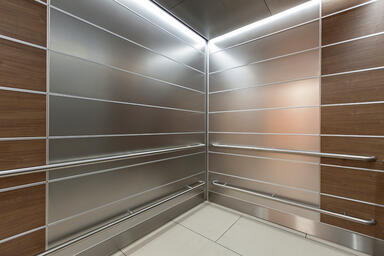 LEVELe-103 Elevator Interior with panels in Stainless Steel with Seastone finish