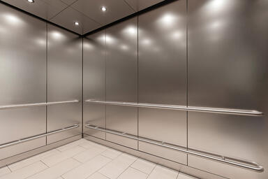 LEVELc-1000A Elevator Interior in Stainless Steel with Seastone finish