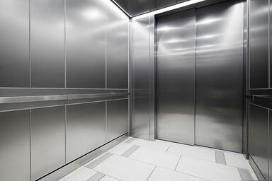 LEVELe-101 Elevator Interior with panels in Stainless Steel with Seastone finish