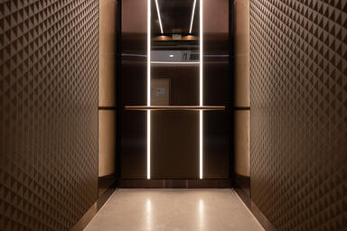 LEVELe-105 Elevator Interior with customized panel layout; Bonded Bronze