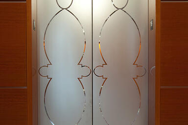 Elevator doors in Stainless Steel with Mirror finish and custom Eco-Etch pattern