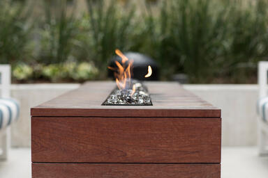 Custom fire table shown with FSC&reg; 100% Jatoba hardwood slats