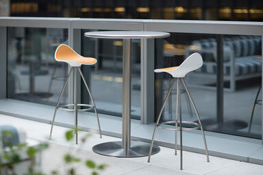 Column Table shown in bar-height configuration with Stainless Steel table top