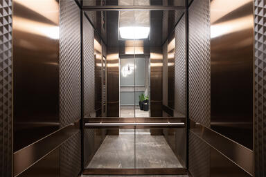LEVELe-105 Elevator Interior with customized panel layout: panels in Fused Metal