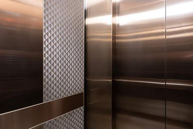 LEVELe-105 Elevator Interior with customized panel layout: panels in Fused Metal